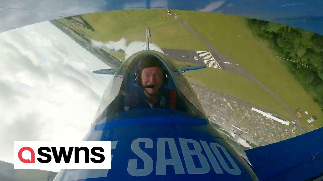 Retired RAF pilot pulls stunts in a aerobatic biplane he built in his shed
